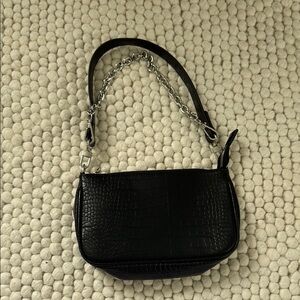 Sleek Black and Silver Shoulder Bag with Minimalist Design